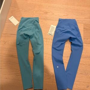 Blue and Teal Lululemon wunder train HR tight 25” pockets